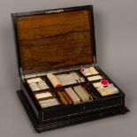 A 19th century Continental ivory inlaid ebony games box The inlaid hinged top enclosing the fitted