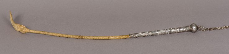 A late 19th century unmarked white metal mounted riding crop The handle with various floral