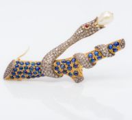 An 18 ct gold diamond and cabochon sapphire encrusted brooch Formed as a snake wrapped around a