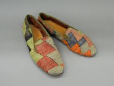 A pair of carpet slippers With leather soles, a label to the interior A T Nicholas Haslam LONDON.