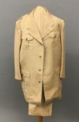 A beige cotton safari suit With horn buttons.