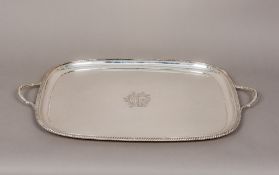 An Edward VII twin handled silver tray, hallmarked Sheffield 1901,