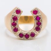 An unmarked gold gentleman's ruby set horseshoe ring Set with eleven rubies,