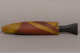 An Australian Aboriginal painted carved wooden model of a fish, possibly a barramundi 45 cm long.