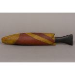 An Australian Aboriginal painted carved wooden model of a fish, possibly a barramundi 45 cm long.