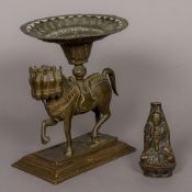 A 19th century Sino-Tibetan patinated bronze model of Buddha Seated in the lotus position holding a