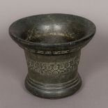 An antique, possibly 17th century, patinated bronze mortar Of typical flared form,