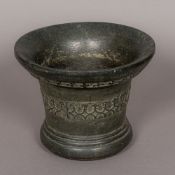 An antique, possibly 17th century, patinated bronze mortar Of typical flared form,