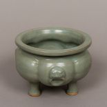 A Chinese pottery censer Of lobed form with allover celadon glaze. 15 cm diameter.
