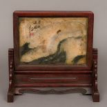 A Chinese hardstone inset wooden table screen The removable screen decorated to one side with