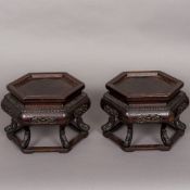 A pair of 19th century Chinese carved wooden urn stands Each of hexagonal form,