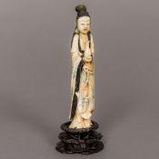 A 19th century Chinese carved ivory figure Formed as Guanyin, holding a vase and beads,