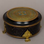 A 19th century French brass mounted ebonised jewellery casket Of hinged circular form,