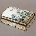 A cloisonne box The domed hinged lid decorated with floral sprays on a rocky outcrop and a bird in