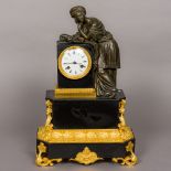 A 19th century ormolu and patinated bronze mounted black slate mantel clock The white enamelled