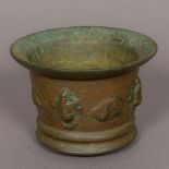 An antique, possibly 17th century or earlier, patinated bronze mortar Of typical form,