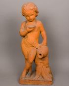 A terracotta sculpture modelled as a young child holding an amphora and a bowl Wearing a sash