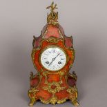 A 19th century ormolu mounted tortoiseshell mantel clock The white enamelled dial with twin