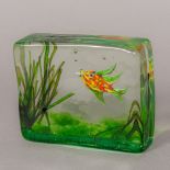 A 20th century Murano glass paperweight Of rectangular form, decorated with a fish amongst reeds.