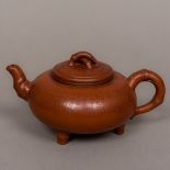 A Chinese Yixing pottery teapot Of squat globular form, with calligraphic decoration,