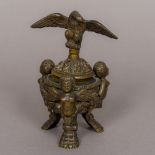 A 19th century Grand Tour patinated bronze lidded urn The removable lid surmounted with an eagle,