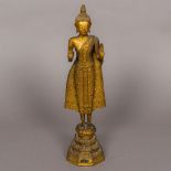 An antique, possibly 17th/18th century, Tibetan gilt bronze Buddha Modelled standing,