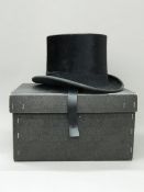 A silk top hat The interior bearing a label Kensington, London W in a modern Lock & Co hat box.