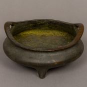 A Chinese patinated bronze censer The underside with four character seal mark and bordered by two