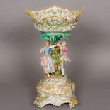 A 19th century Meissen porcelain centrepiece The florally encrusted pierced basket supported by