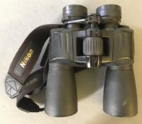 A pair of Nikon Action EX 12 x 50 waterproof field glasses Provenance: The property of the Late