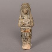 An Egyptian antiquity ushabti Of typical form. 13 cm high.