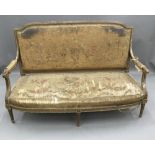 A 19th century French tapestry upholstered giltwood settee The florally upholstered padded back