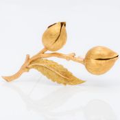 An 18K gold brooch Formed as a flowering stem. 9 cm wide.
