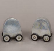A pair of 1960s polished aluminium cruets Each wheeled, one inscribed Salt 4 Me,