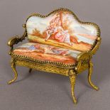 A 19th century Vienna enamel decorated miniature settee Decorated with scenes of figures in a