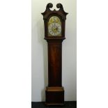 An 18th century mahogany cased longcase clock The rosette carved arched broken swan-neck pediment