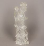 A large Chinese rock crystal carving of Guanyin Typically modelled, holding a flower in a vase. 26.