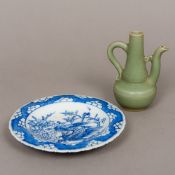 A small Chinese celadon green porcelain water dropper Of ewer form;