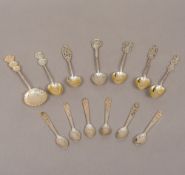 A quantity of Chinese silver tea/coffee spoons Of varying design. The largest 12.5 cm long.