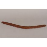 A vintage Australian carved wooden boomerang Of typical form. 50.5 cm long.