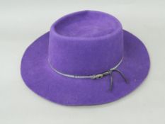 A purple felt wide brimmed hat The interior stamped Dorfman Pacific Stockton California.