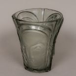 An Art Deco frosted and clear glass vase Of flared form, decorated with three differing faces. 18.