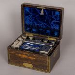 A 19th century brass inlaid coromandel travelling box Of rectangular hinged form,