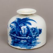 A Chinese blue and white porcelain ink pot Decorated with a female figure seated at a low table,