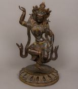 A patinated bronze cabochon stone set figure of Buddha Modelled standing on one leg,