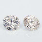 Two unmounted diamonds Each measuring between 0.25 and 0.50 of a carat.