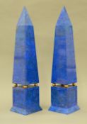 A pair of lapis lazuli clad obelisks Each of typical form with brass ball dividers.