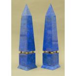 A pair of lapis lazuli clad obelisks Each of typical form with brass ball dividers.