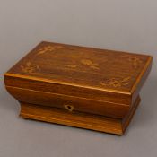 A 19th century French marquetry inlaid kingwood sewing box The florally inlaid hinged lid enclosing