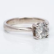 An 18 ct white gold diamond solitaire ring The claw set stone spreading to approximately 1.